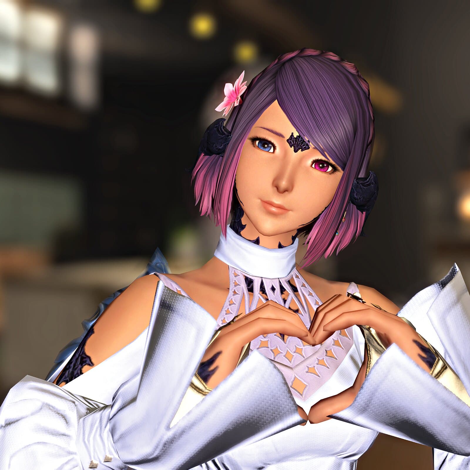 Naru in a white and gold high-collared outfit, a pink blossom pinned in her lavender bob, making a heart shape with both hands
