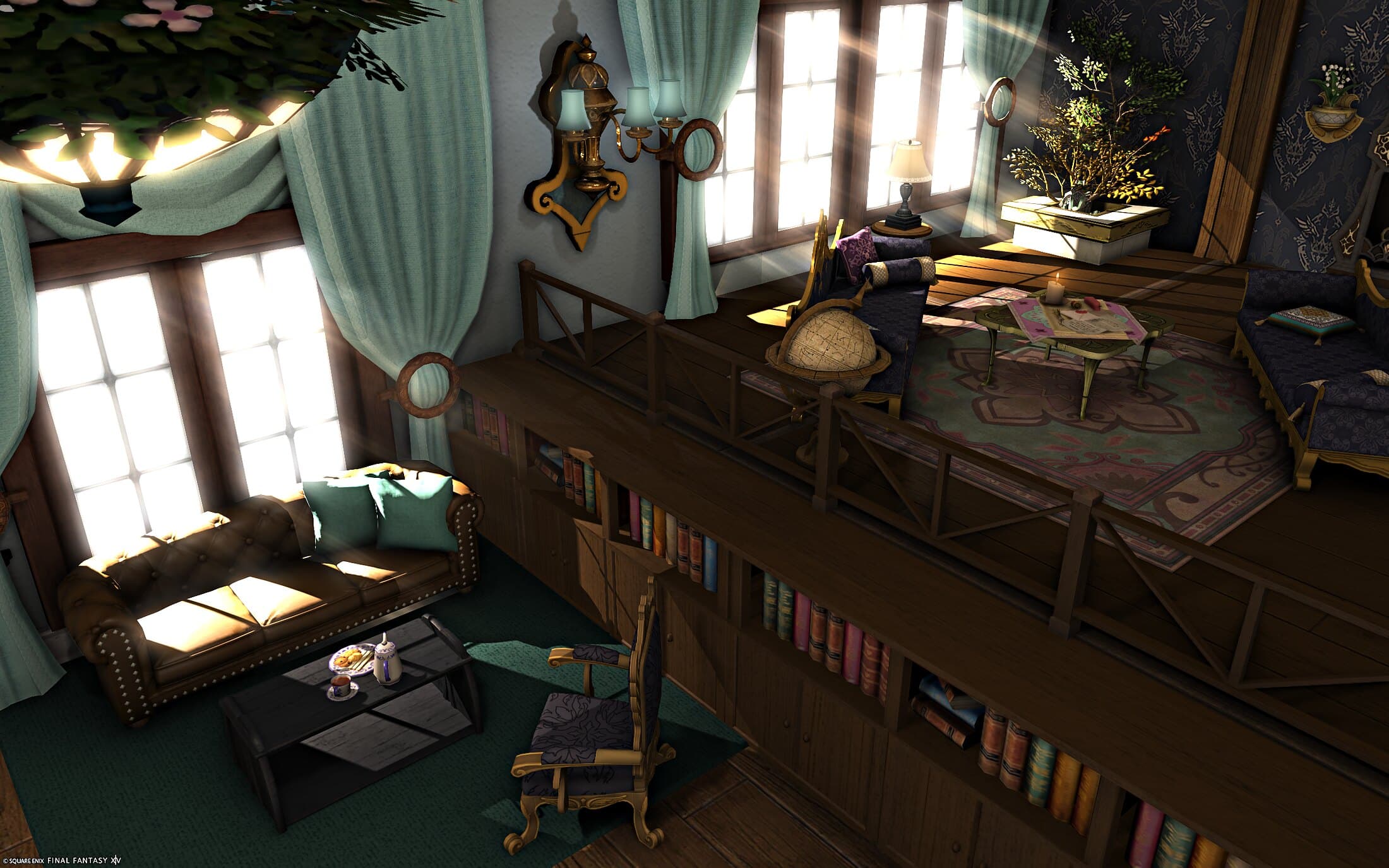 The living room's tea corner from above — a leather sofa with teal cushions, a carved armchair and a low table laid with tea — beside the raised platform, its railing above built-in bookshelves, with a globe, a navy settee, a table with a candle and a tree in a white planter up on top