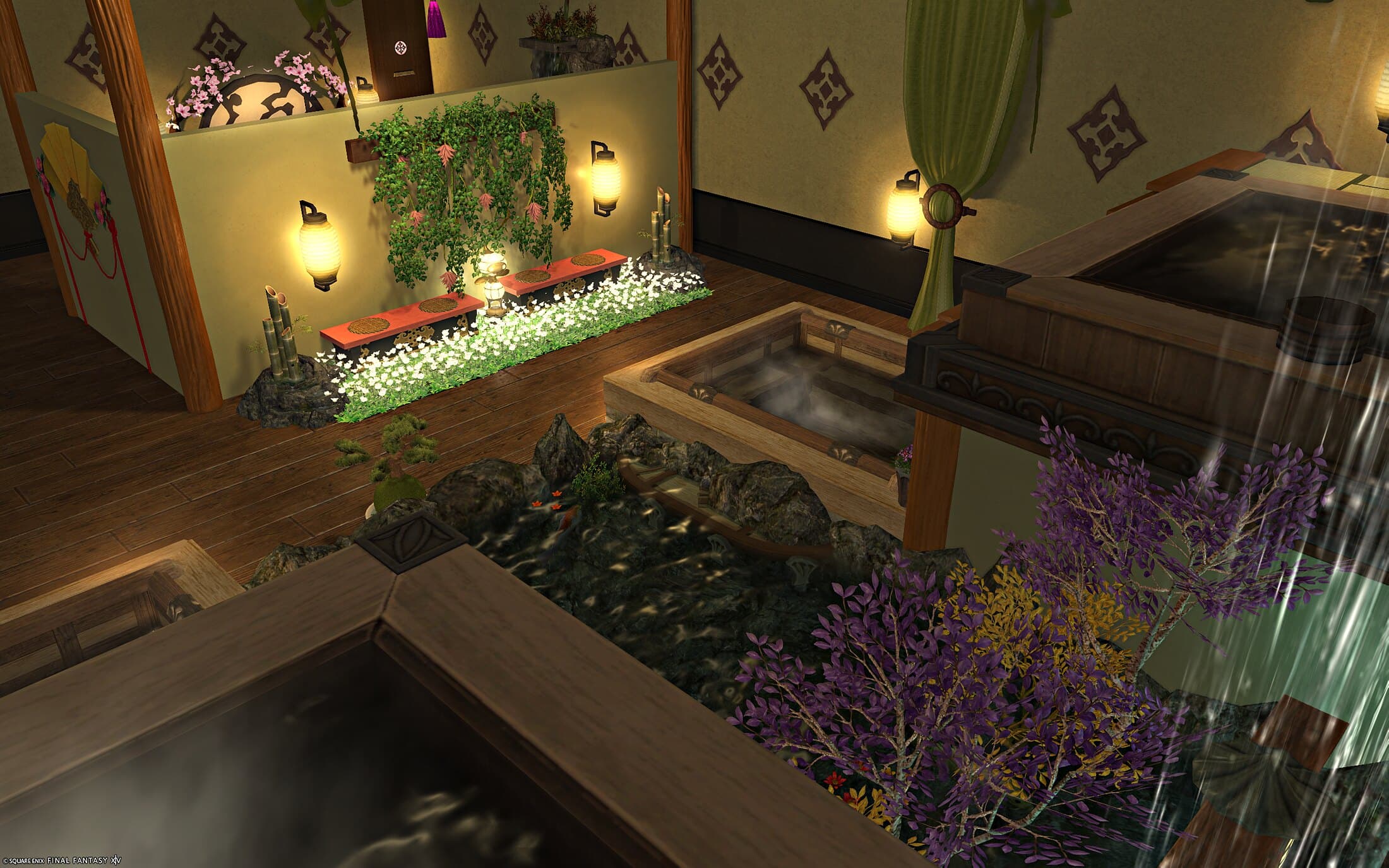 The bath hall from above — a red bench in a bed of white flowers under a wall of hanging vines, a green curtain, and the baths and pond in front