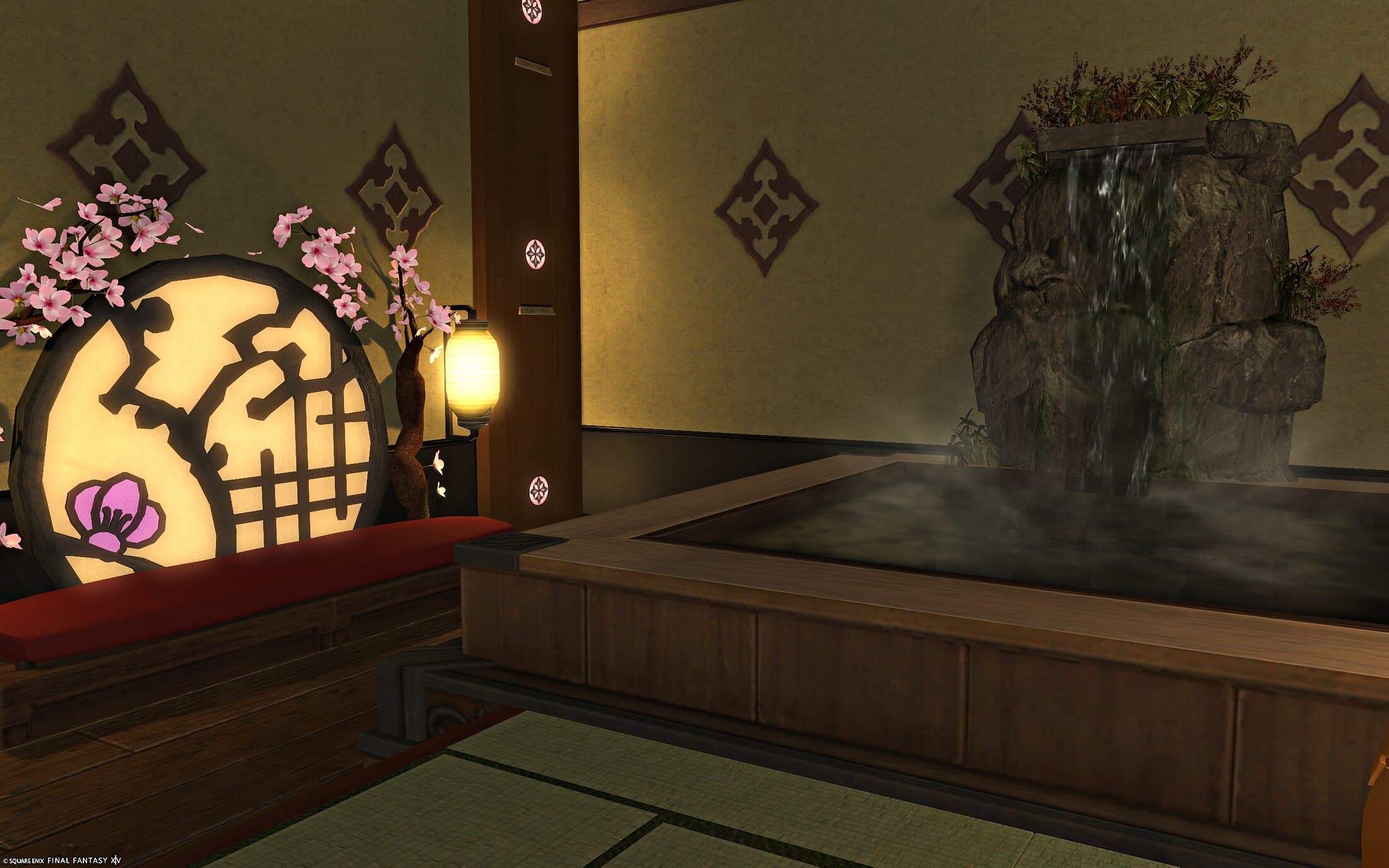 The private nook's bench — a red-cushioned bench wrapped around a round window, cherry blossoms growing over it, a lantern beside it and the bath's rock waterfall at the right