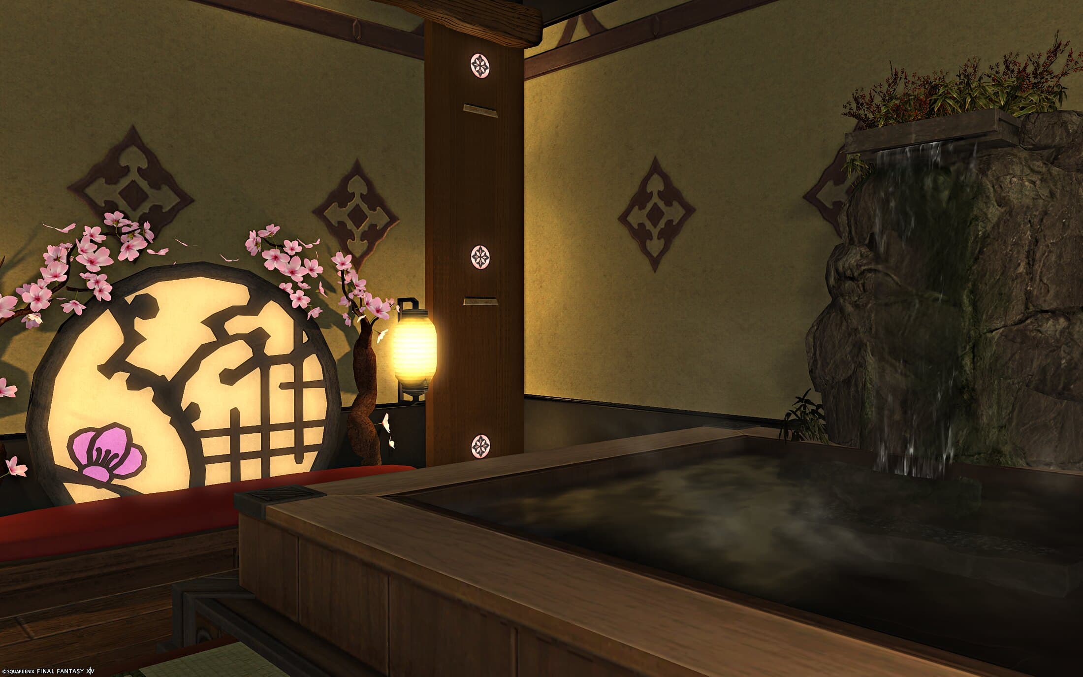 The private bath from the other side, steam on the water, the rock waterfall behind it and the blossom-wrapped round window bench at the left