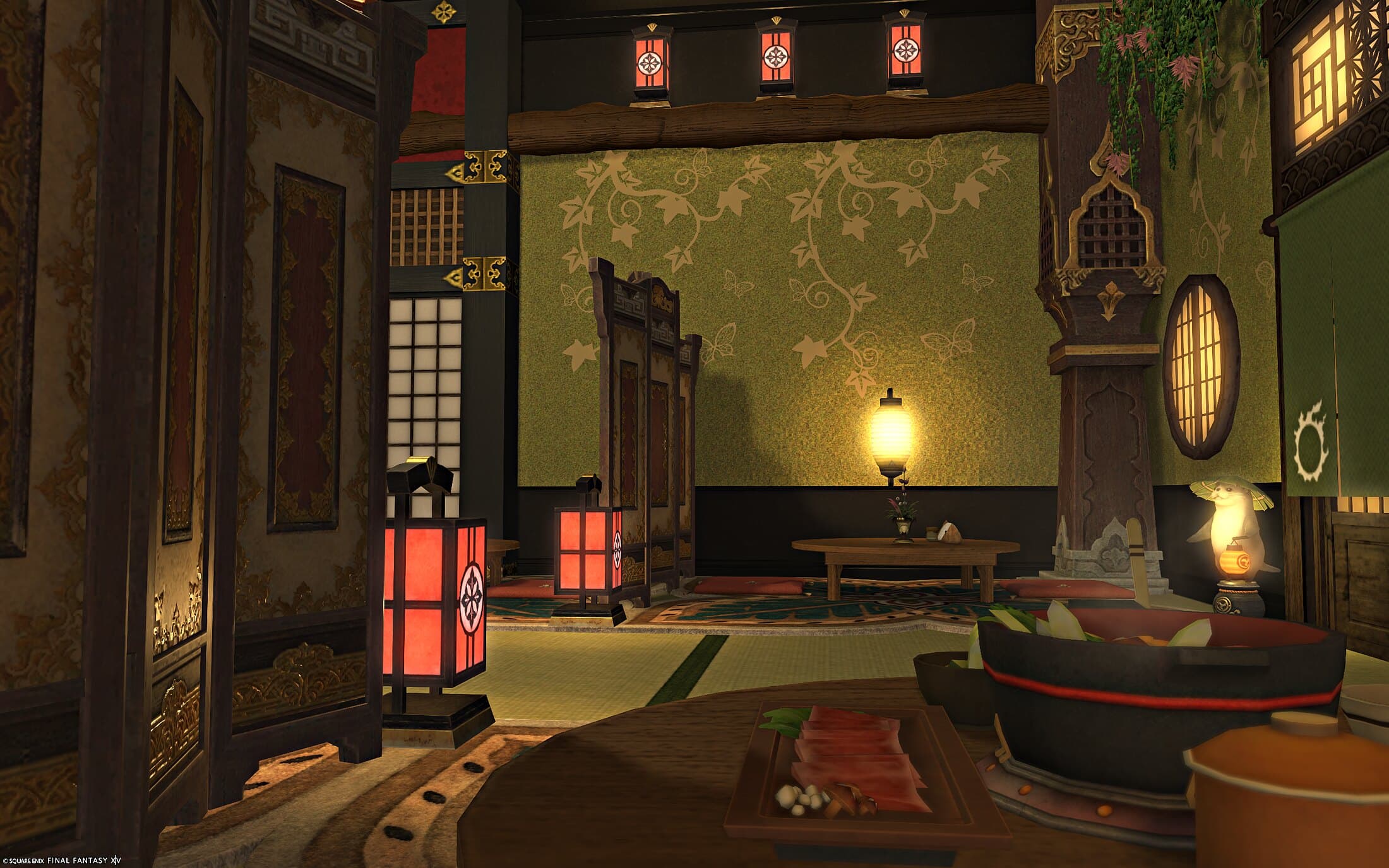 The restaurant upstairs — red lanterns along a wooden beam, a carved pillar with vines, a round window, green patterned walls and a hotpot on a low table in the foreground
