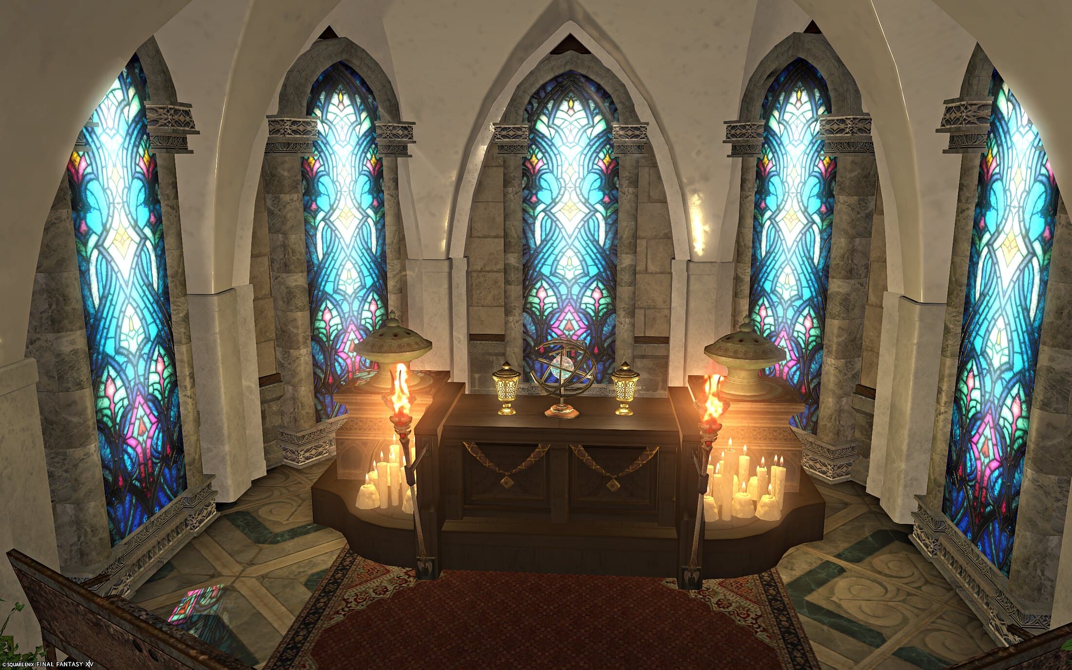 The altar straight on — a dark wood altar with a brass globe in its rings and two gold lanterns, green urns either side, flaming torches and clusters of candles, and five tall stained-glass windows in turquoise, blue and pink standing in an arc behind it under white vaults