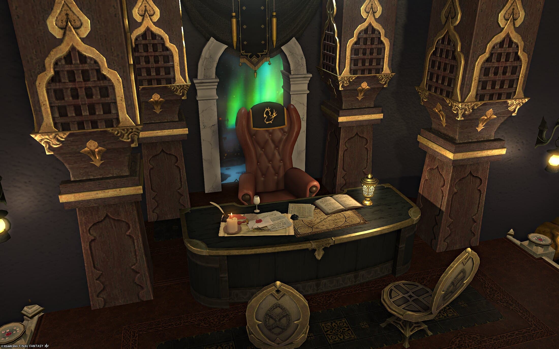 The desk on the platform — a leather wingback chair, an open ledger, a candle and an urn, with a lit window behind