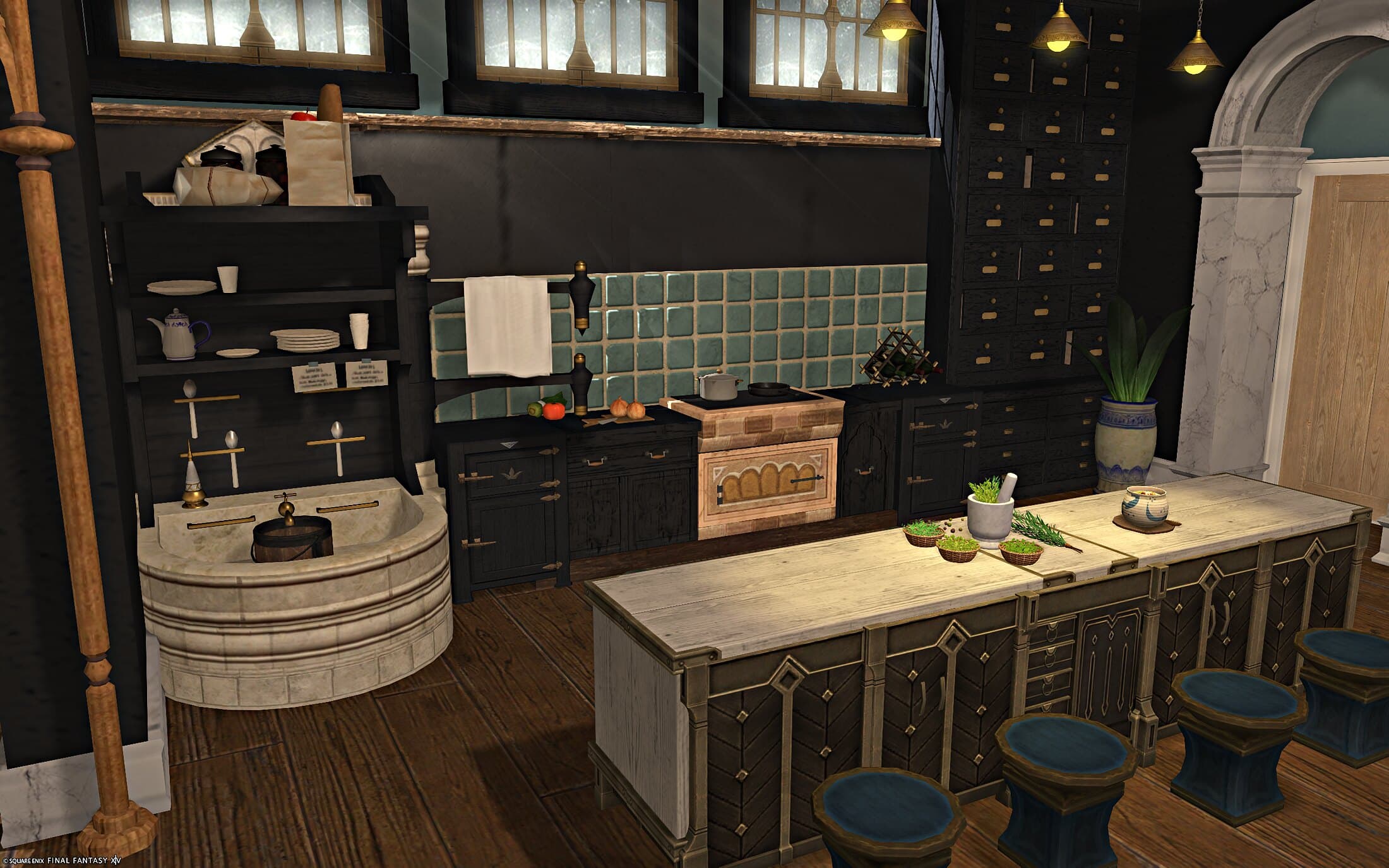 The kitchen — a stone basin sink, dark cabinetry under a sage tile backsplash, a wall of small drawers, and a long island with blue-topped stools