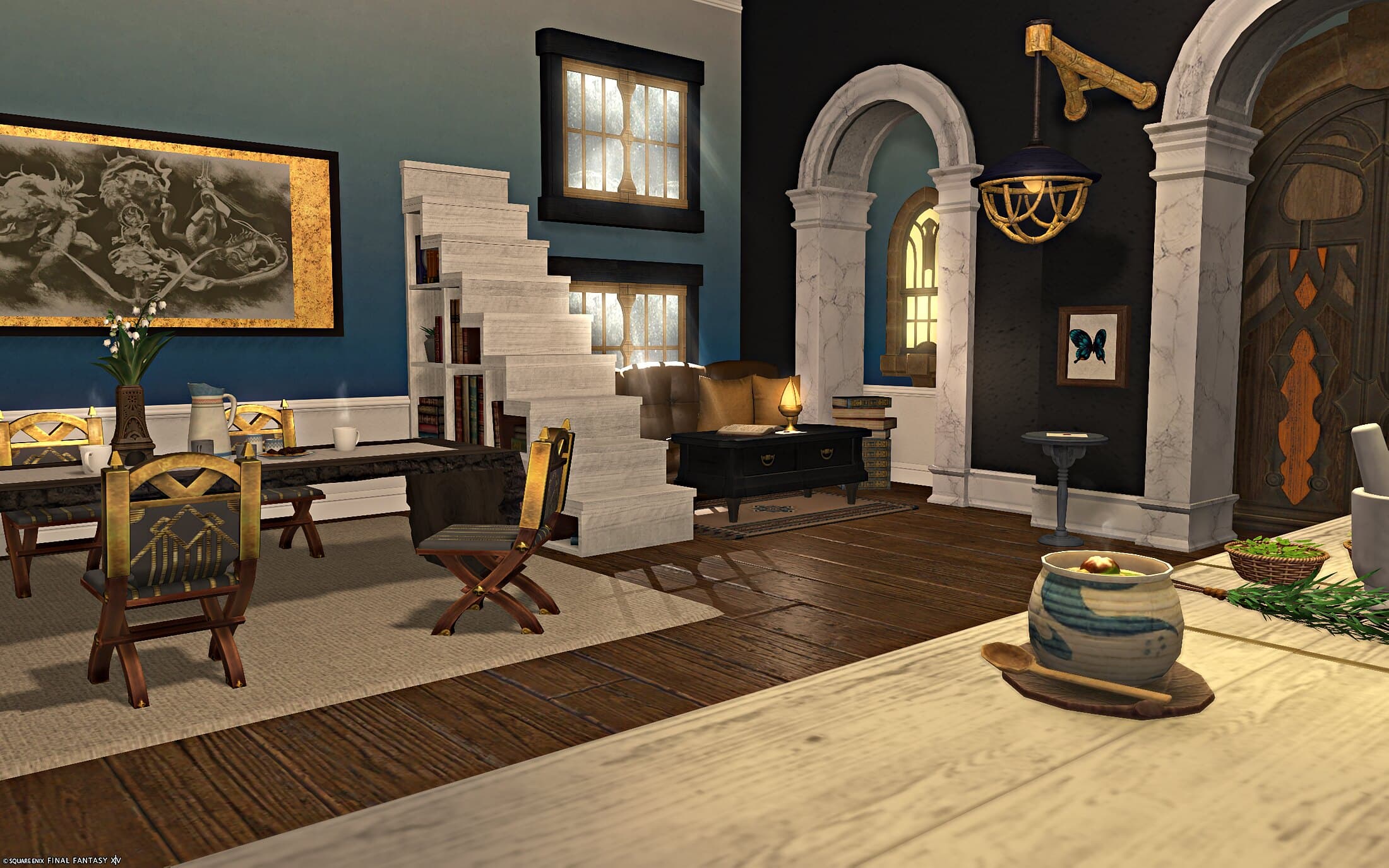 The lounge and dining area — teal walls, white wooden stairs, a gold-framed engraving and a live-edge table