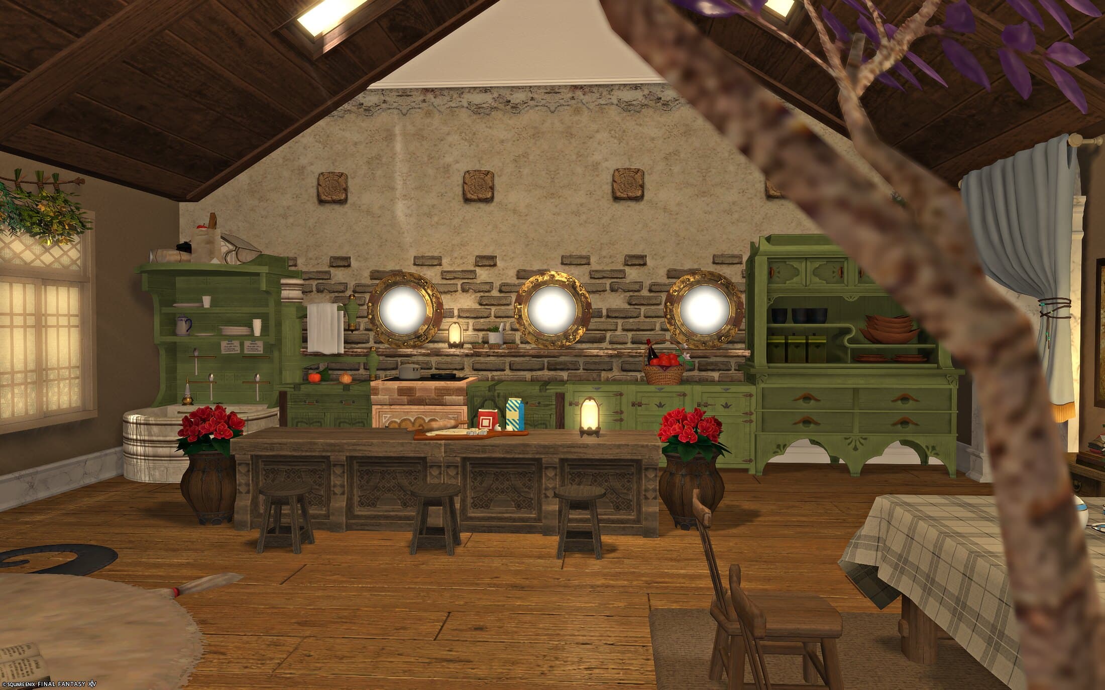 The kitchen seen past a wisteria branch, the porthole-set brick wall and green cabinetry behind a long counter and stools