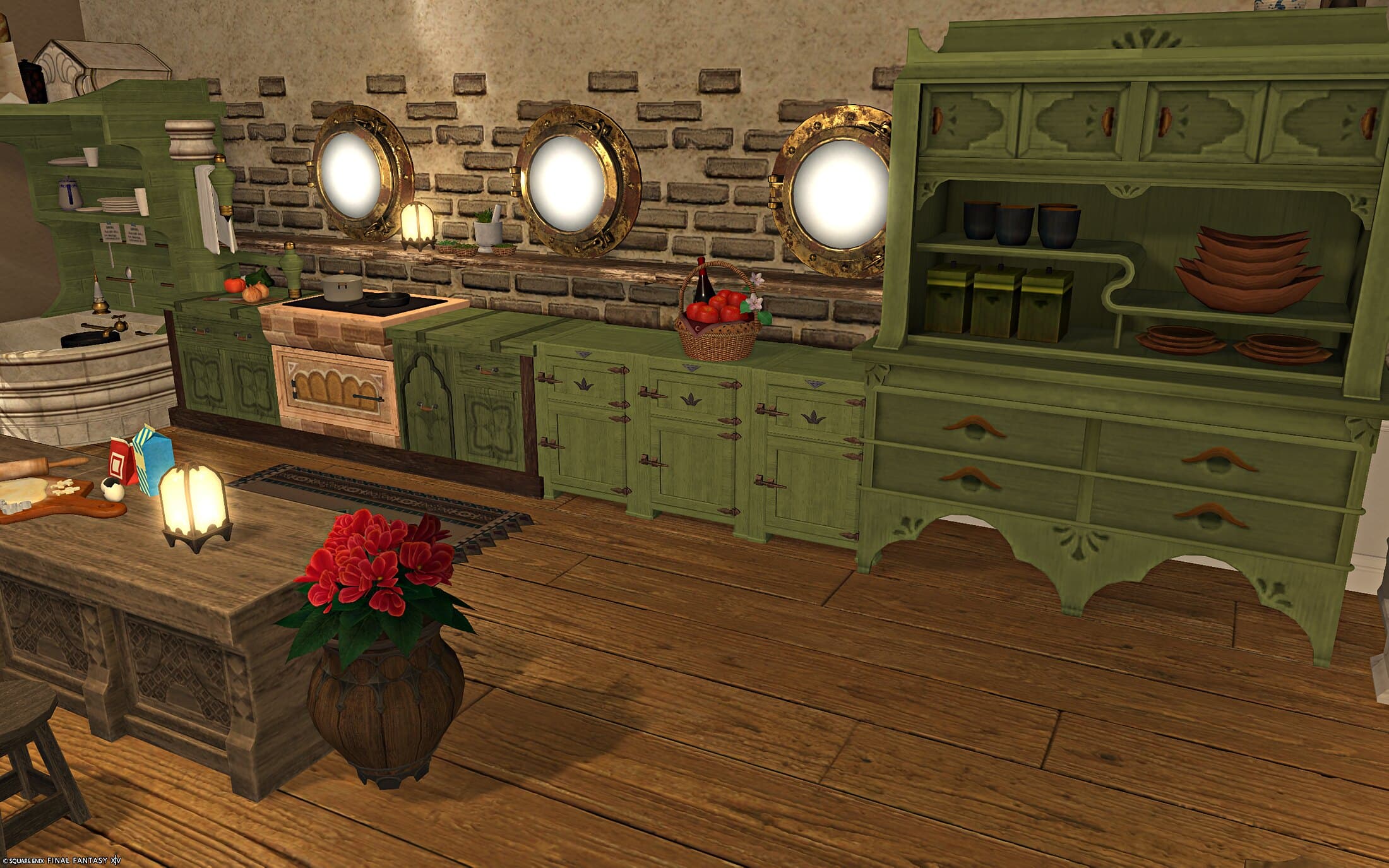 The kitchen close up — a tiled stovetop, the three gilt porthole windows above the brick wall, and open shelves of jars and dishes in the green hutch beside it