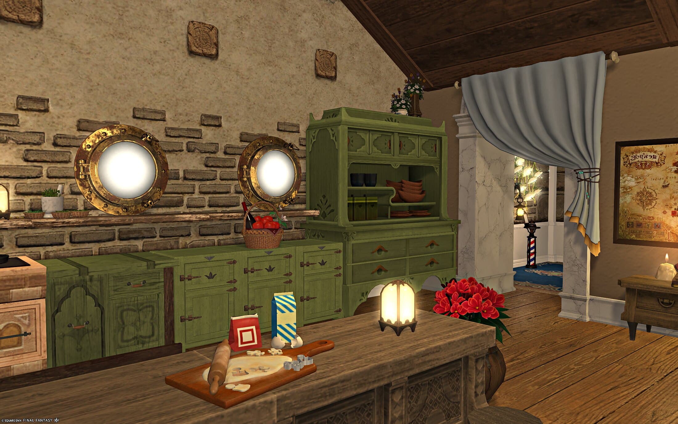 The kitchen counter with baking laid out on a board, a woven basket of fruit beside it, and a curtained doorway opening onto a hall with a lighthouse figure beyond