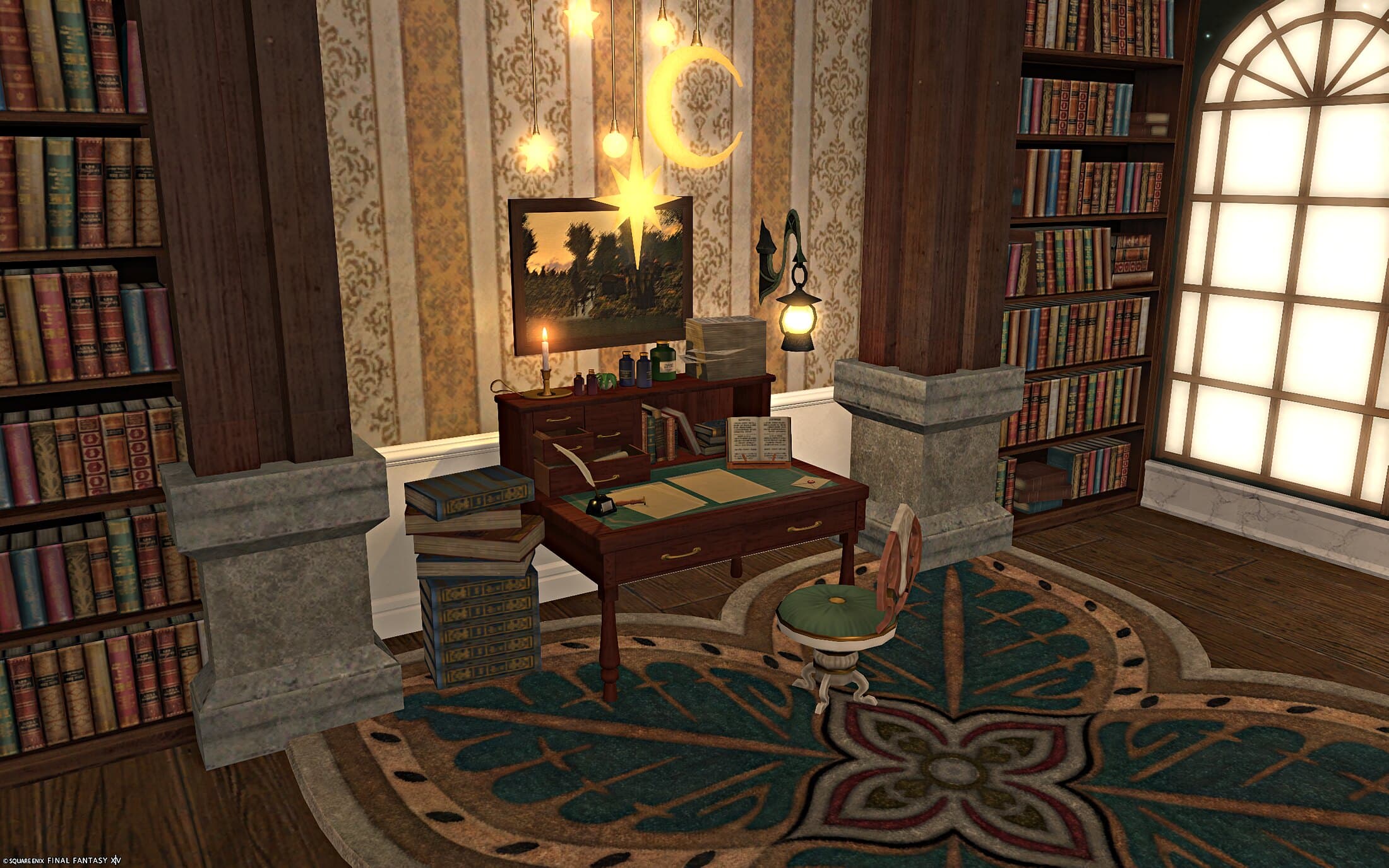 The desk close up, set into a gap in the bookshelves under hanging moon and star lights, a painting propped above it and books stacked beside the chair