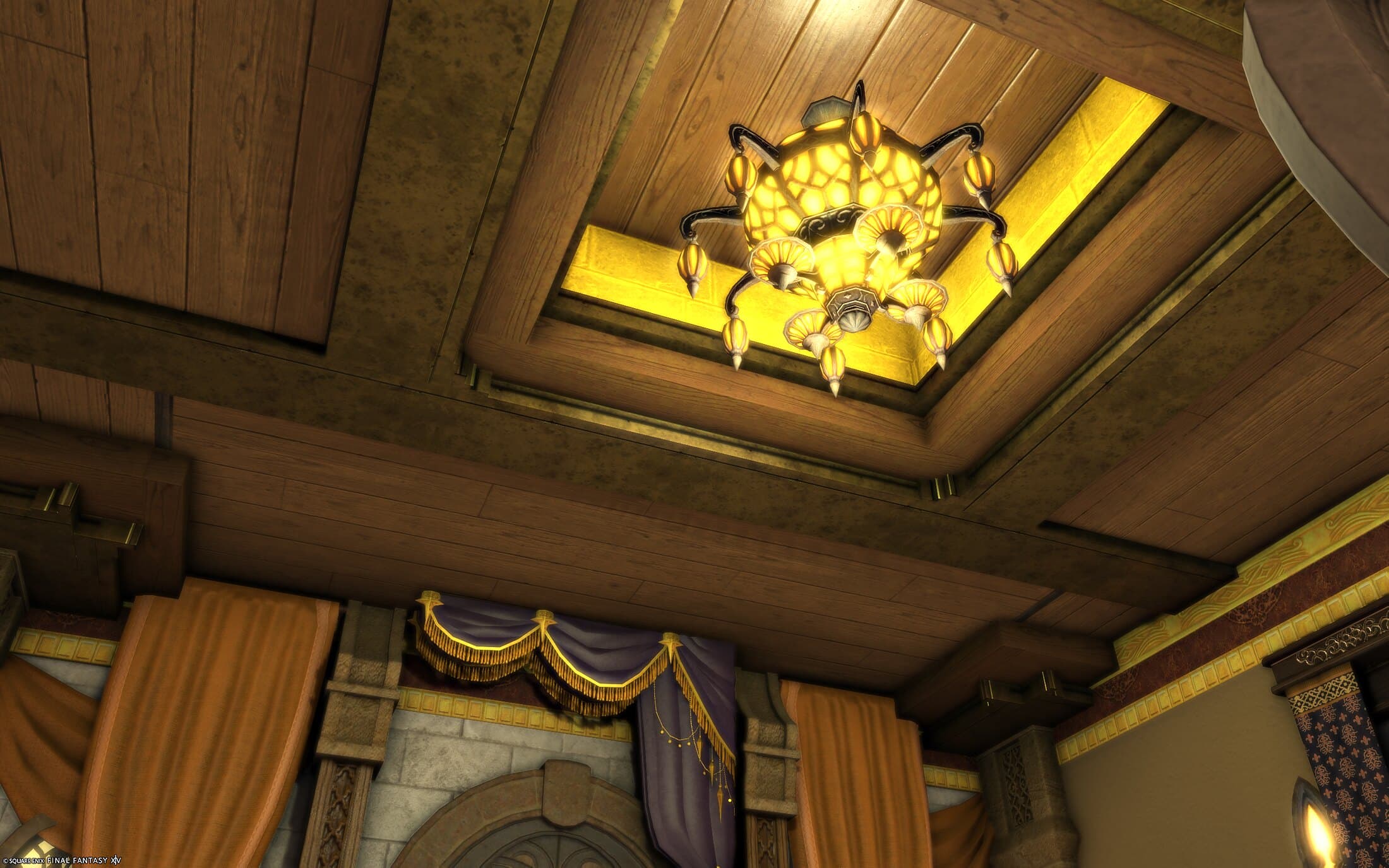 The coffered ceiling — wooden coffers stepping up to a recessed centre lit gold around a chandelier of glowing amber globes, orange curtains and a purple swag valance at the tops of the walls below
