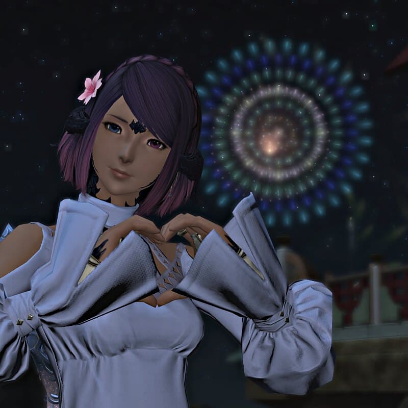 Naru in a white and lavender outfit, making a heart shape with both hands, a firework blooming in the night sky behind her