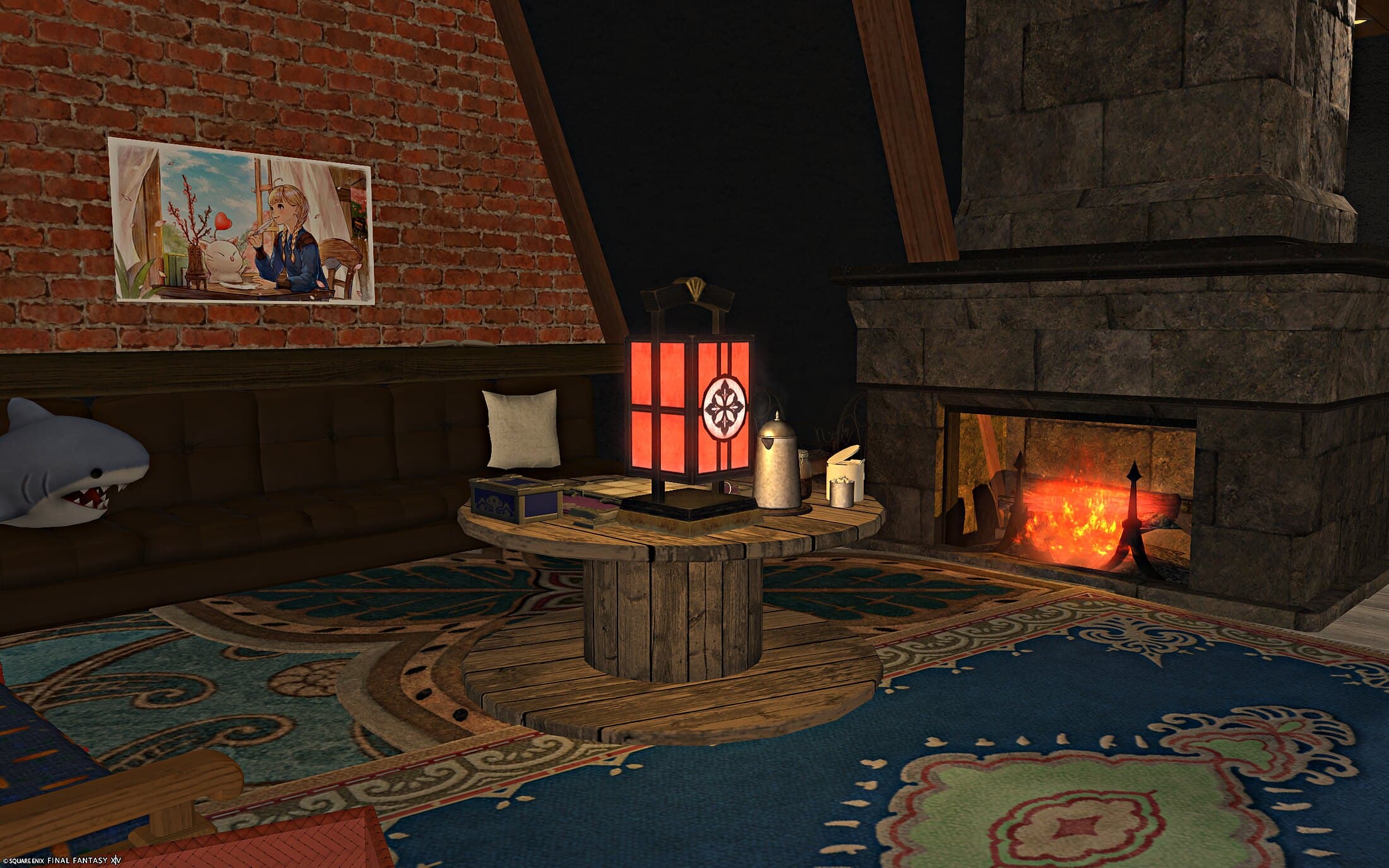 A lit stone fireplace with a stump table and a red paper lantern on a layered blue rug