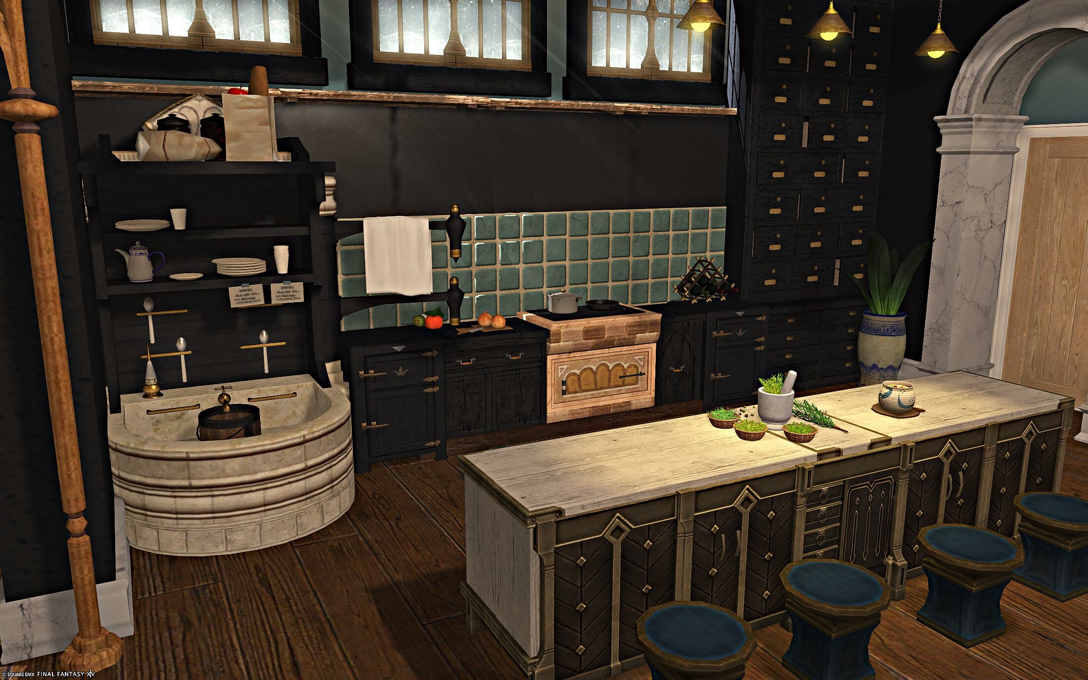 The kitchen — a stone basin sink, dark cabinetry under a sage tile backsplash, a wall of small drawers, and a long island with blue-topped stools